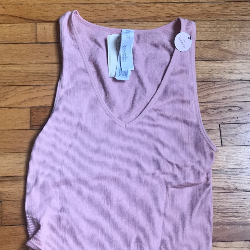 Blush pink tank top body suit.